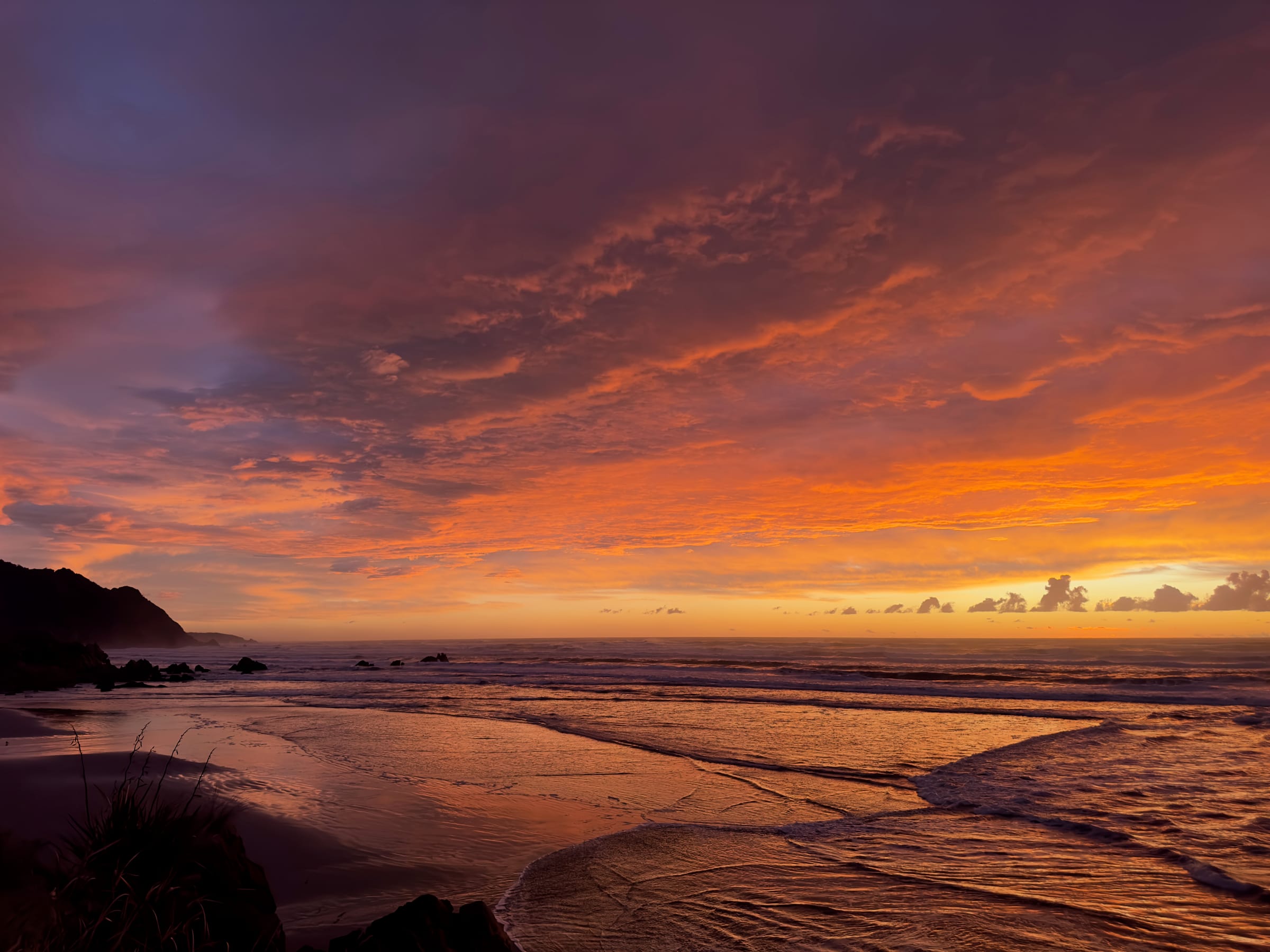 Dramatic orange and purple beach sunset