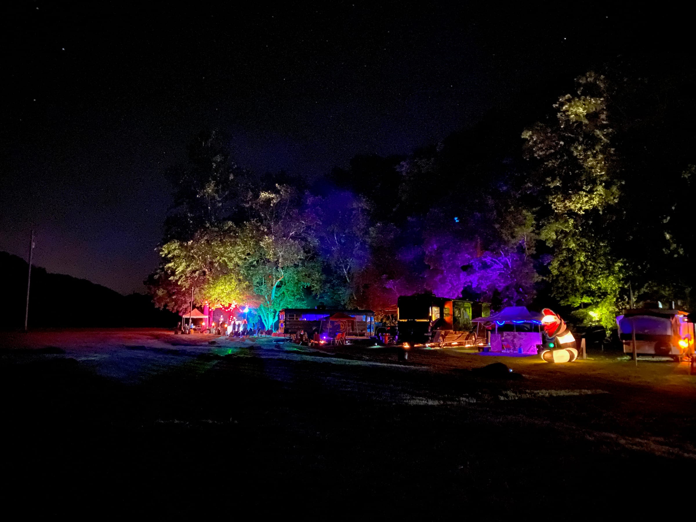Campervans under dramatic sunset sky