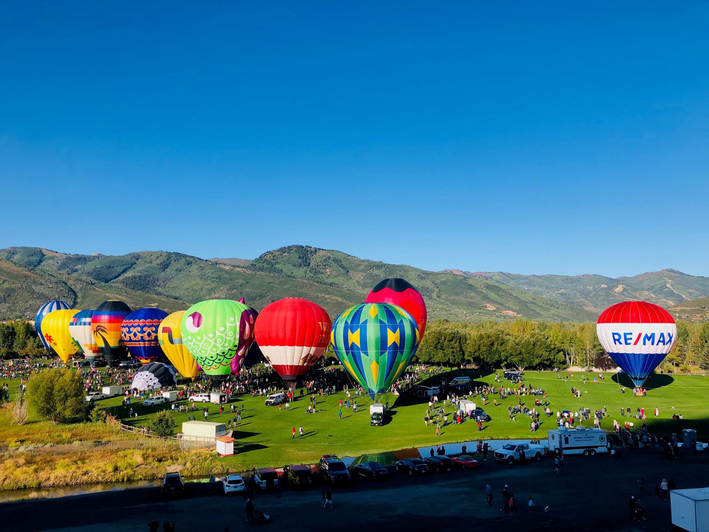 Hot air balloons in a mountain valley