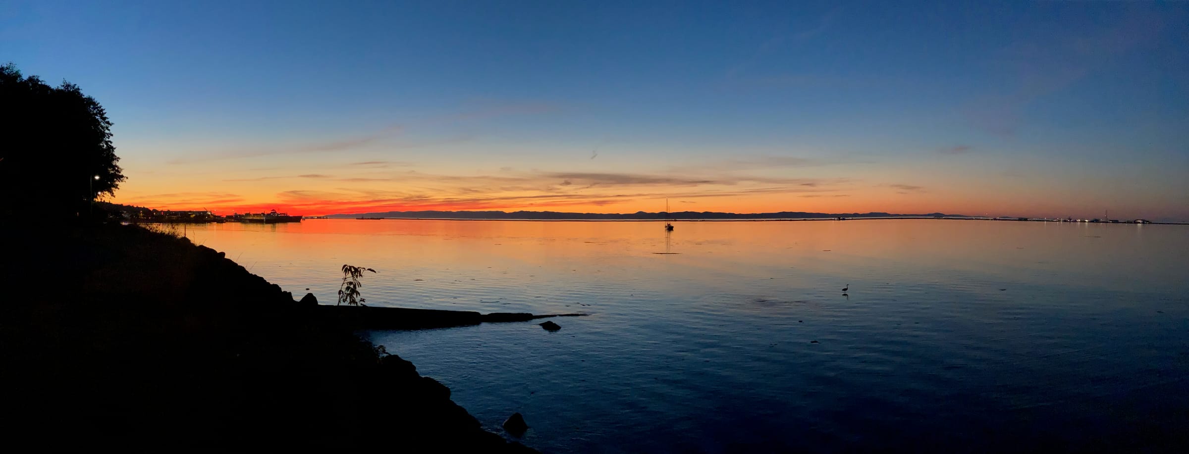 Panoramic sunset over calm water