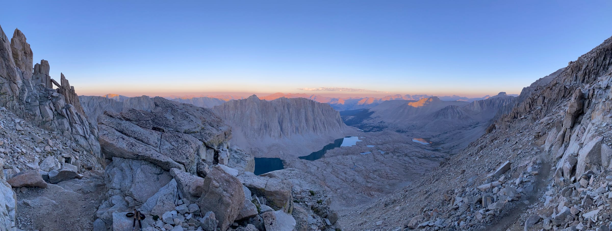 Panoramic view of mountain pass with alpine lakes at dawn